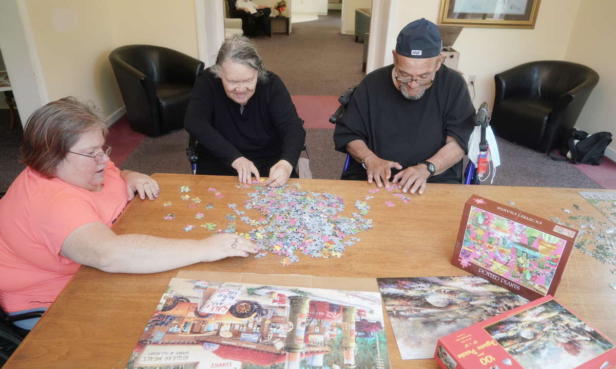 Residents putting together a puzzle
