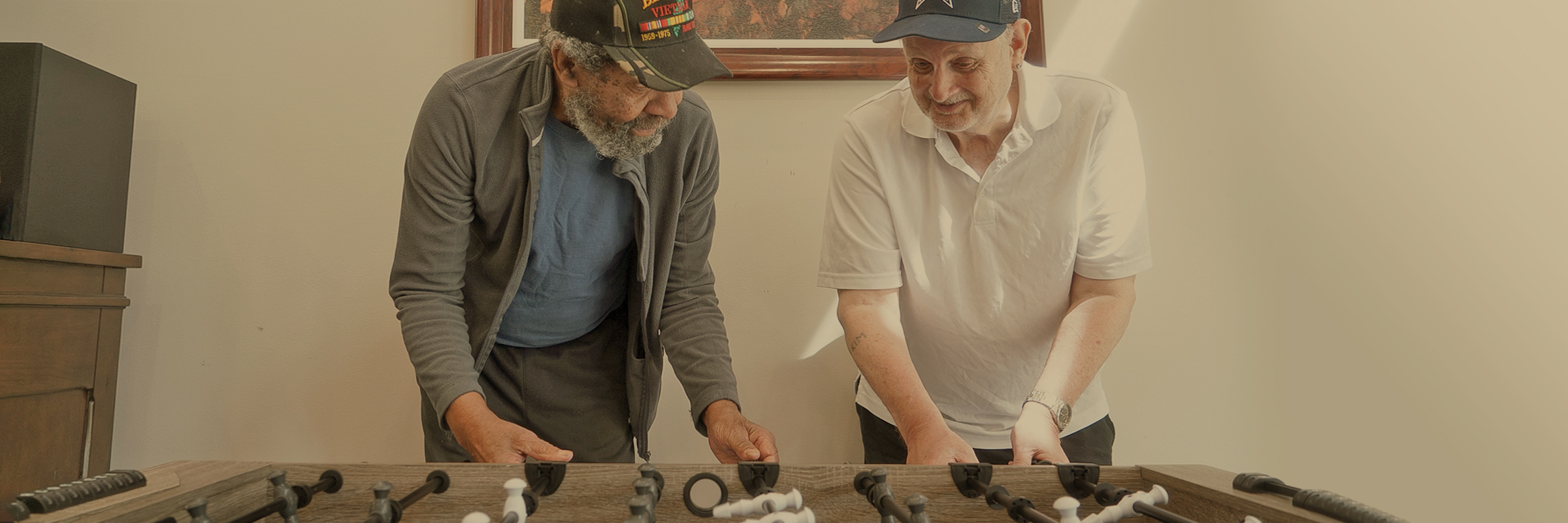 Residents playing foosball
